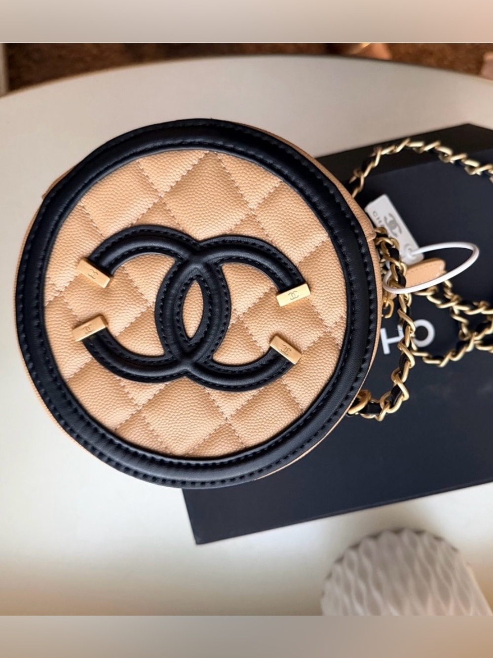 Quilted Beige Round Crossbody with Black Trim and Gold Chain